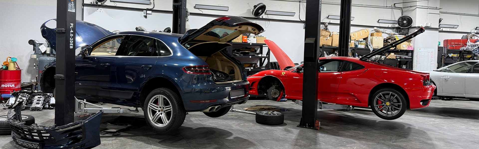 Cars on the ramps in the workshop at Carros Centre